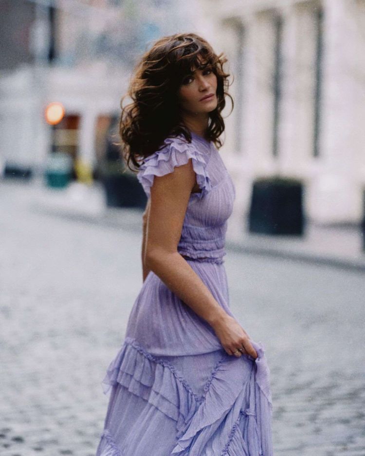 Helena Christensen Posing In A Purple Dress Out On The Street