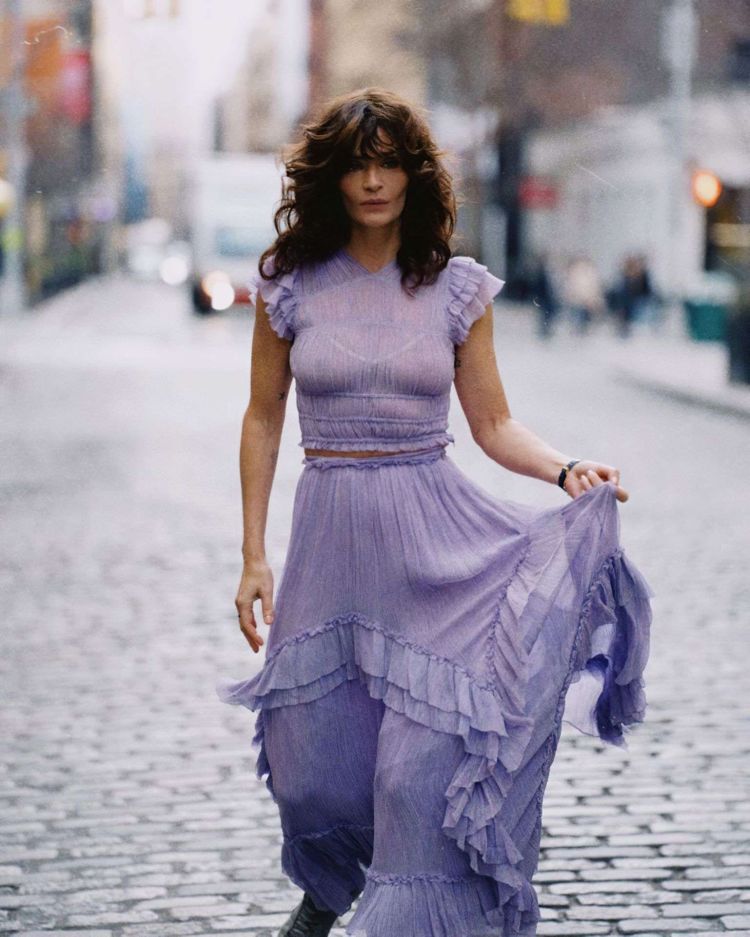 Helena Christensen Posing In A Purple Dress Out On The Street