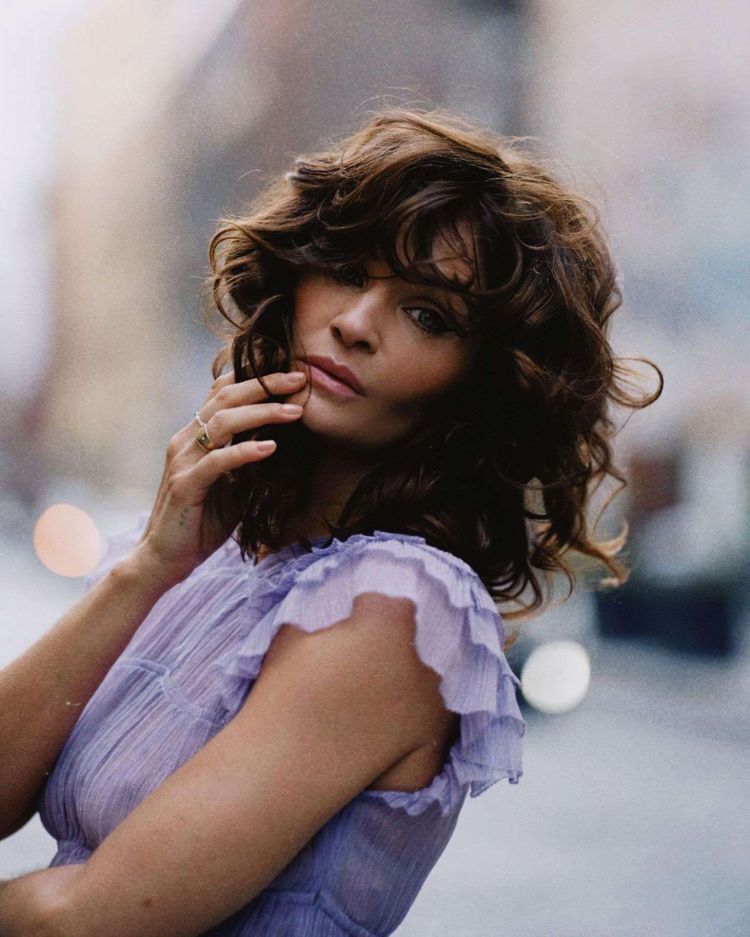 Helena Christensen Posing In A Purple Dress Out On The Street