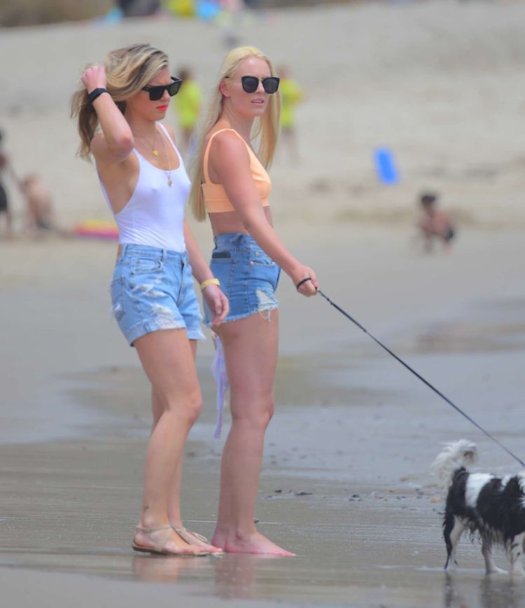 Lindsey Vonn Walks In Shorts On The Beach With Her Sister
