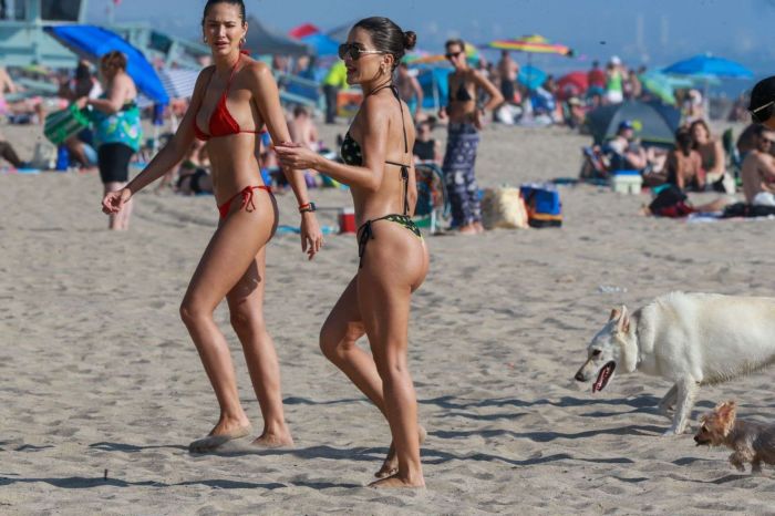 Camila Coelho Vacationing In A Black And Green Bikini At The Beach