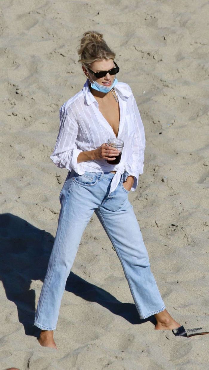 Charlotte McKinney In A Bikini Top And Blue Jeans At The Beach