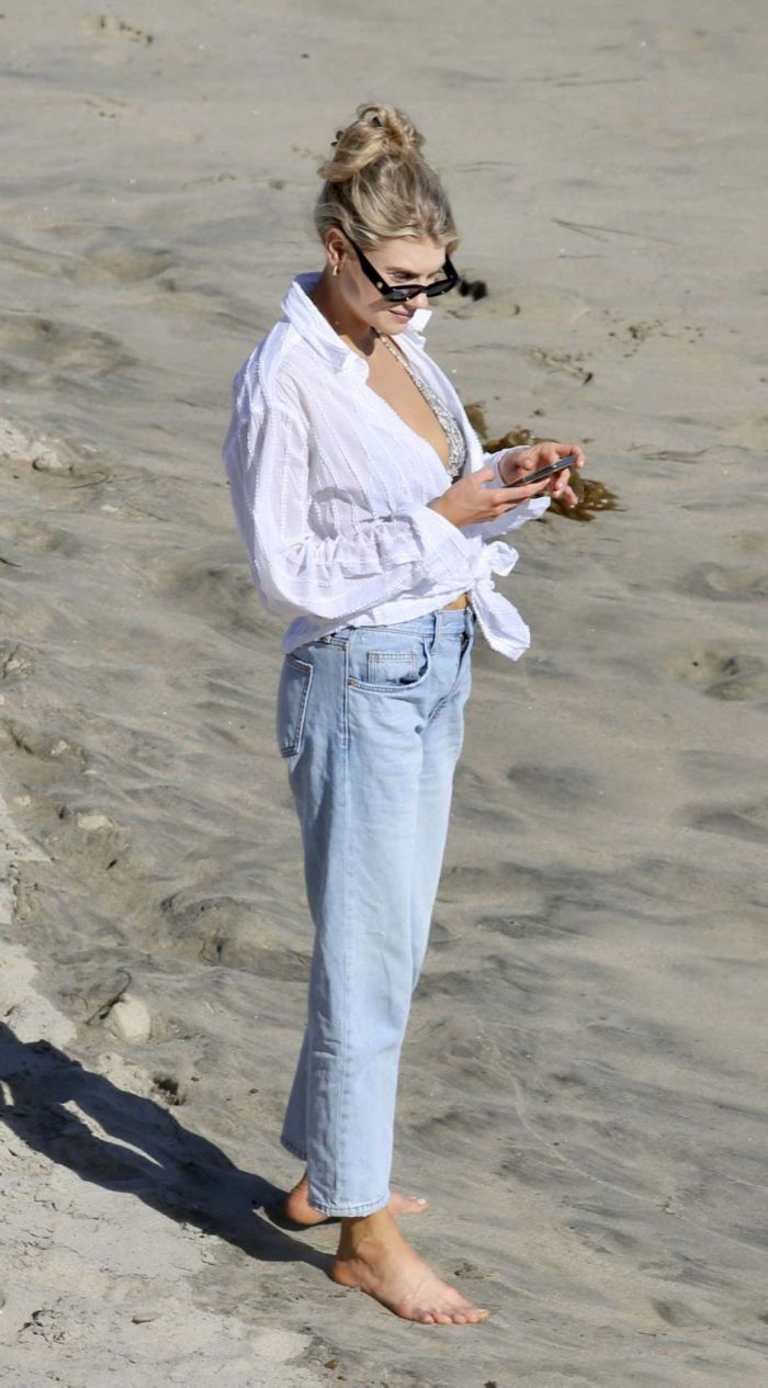 Charlotte McKinney In A Bikini Top And Blue Jeans At The Beach