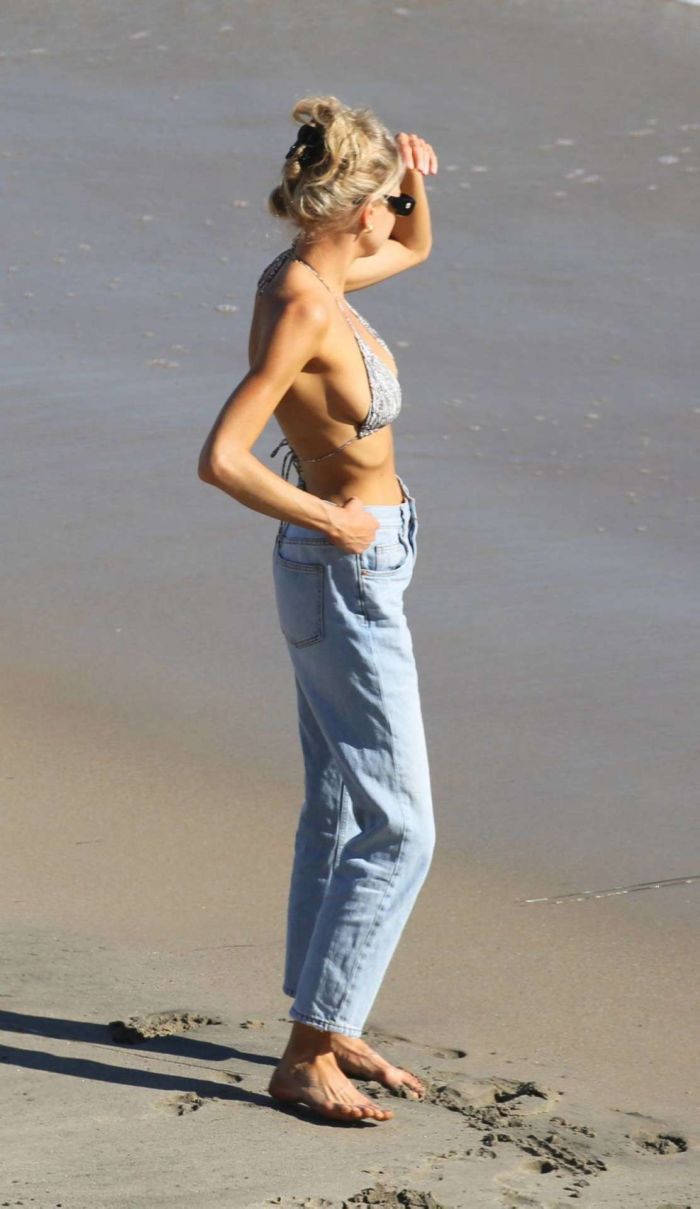 Charlotte McKinney In A Bikini Top And Blue Jeans At The Beach