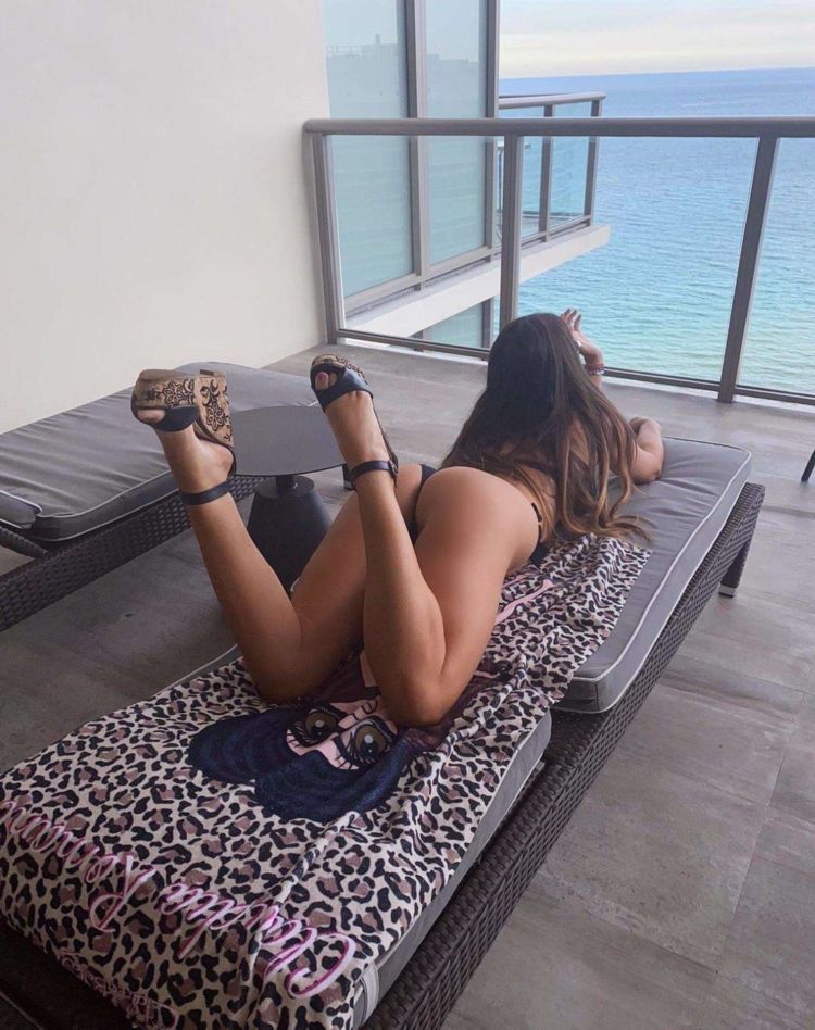 Claudia Romani Relaxing In A Black Bikini At A Resort