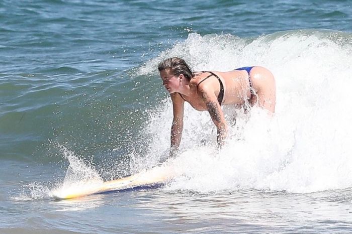 Ireland Baldwin Surfboarding In A Blue Bikini At The Beach In Malibu