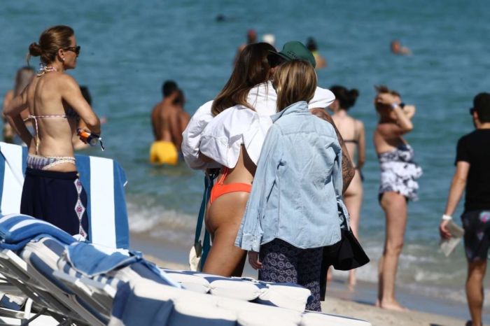 Lorena Rae Tanning In An Orange Bikini On The Beach In Miami