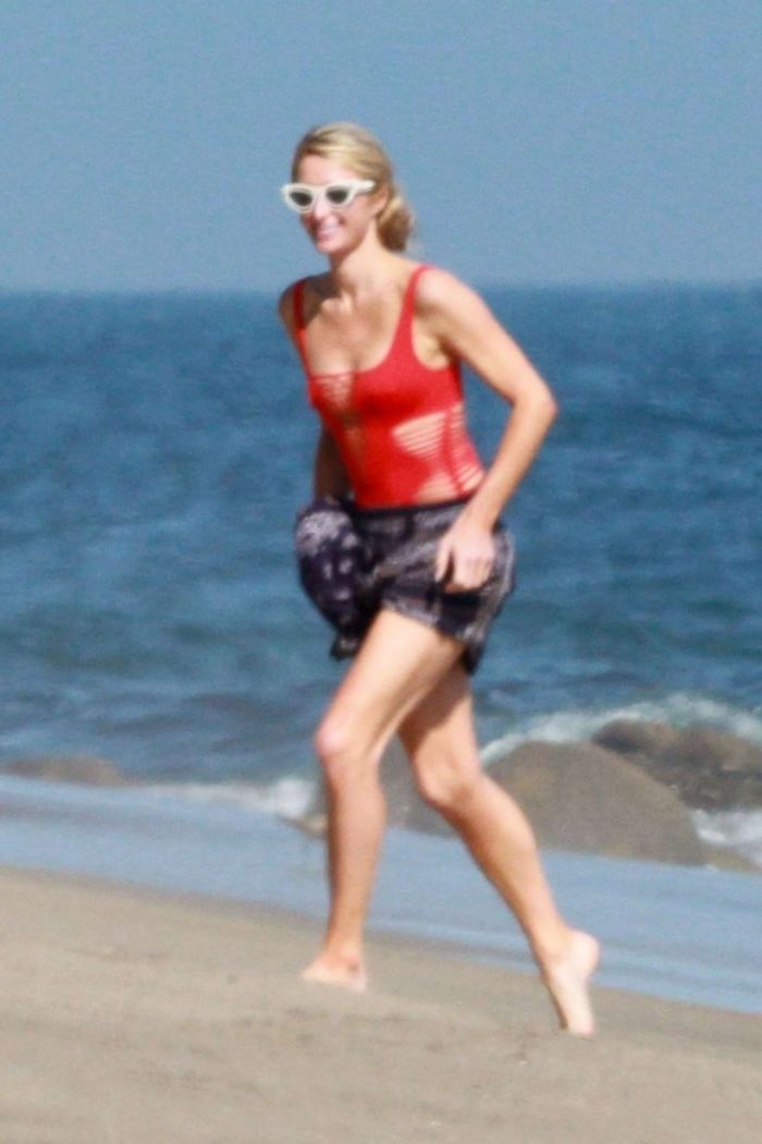 Paris Hilton Vacationing In A Red Swimsuit On The Beach In Malibu