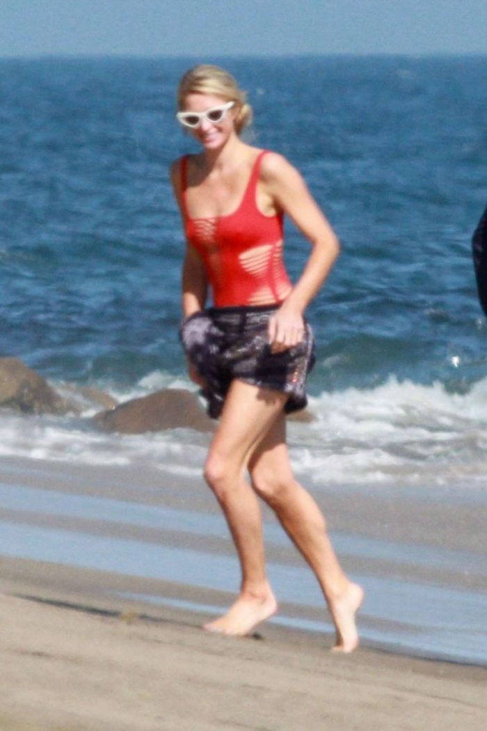 Paris Hilton Vacationing In A Red Swimsuit On The Beach In Malibu