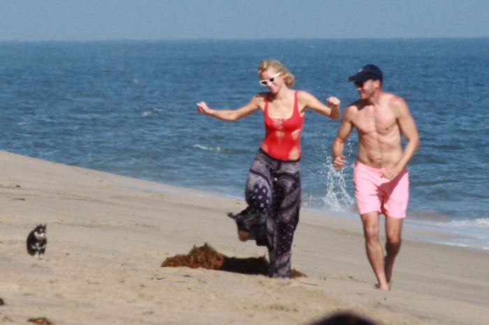 Paris Hilton Vacationing In A Red Swimsuit On The Beach In Malibu