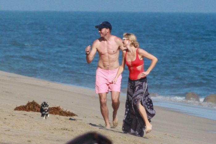 Paris Hilton Vacationing In A Red Swimsuit On The Beach In Malibu