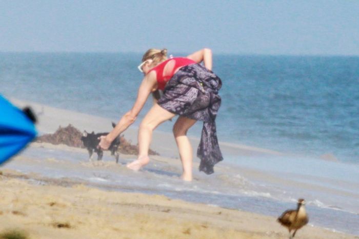 Paris Hilton Vacationing In A Red Swimsuit On The Beach In Malibu