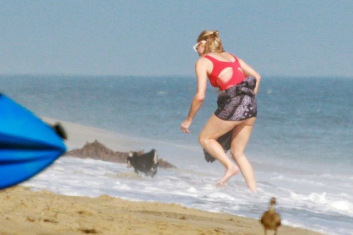 Paris Hilton Vacationing In A Red Swimsuit On The Beach In Malibu