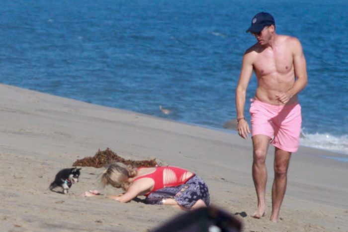 Paris Hilton Vacationing In A Red Swimsuit On The Beach In Malibu