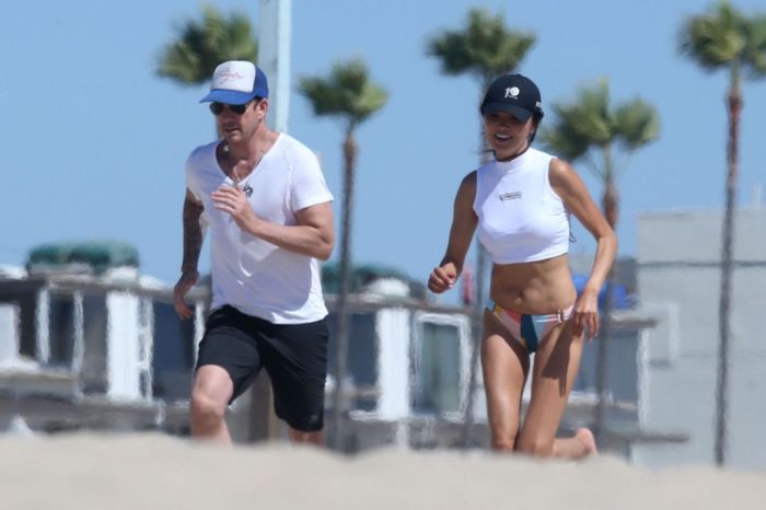 Soo Yeon Lee And Dylan McDermott Playing Beach Games In Los Angeles