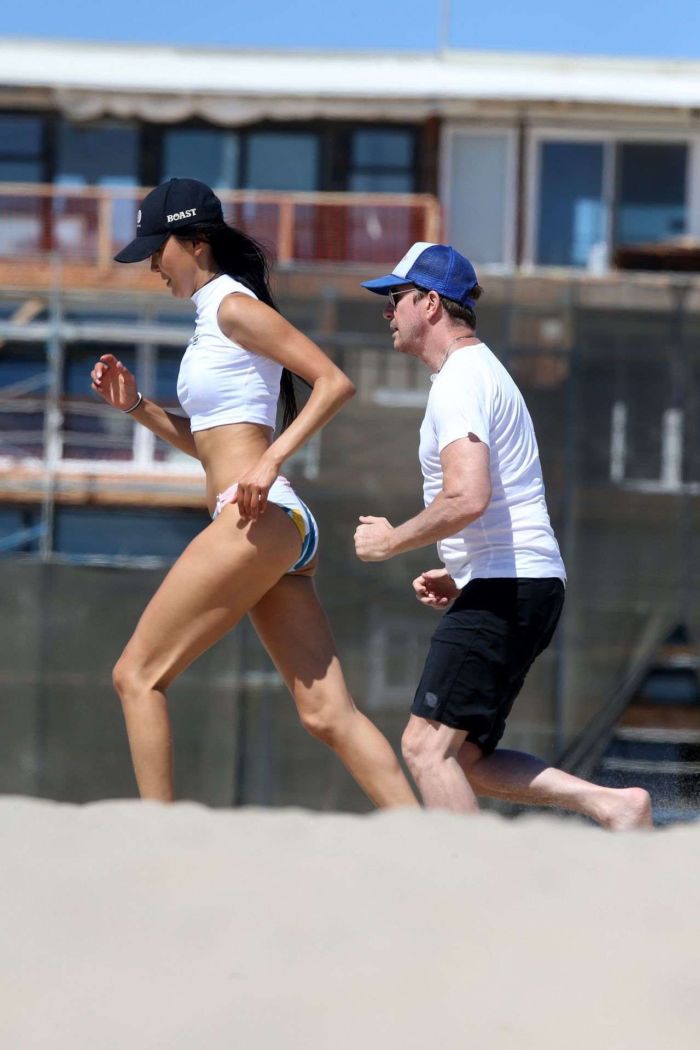 Soo Yeon Lee And Dylan McDermott Playing Beach Games In Los Angeles